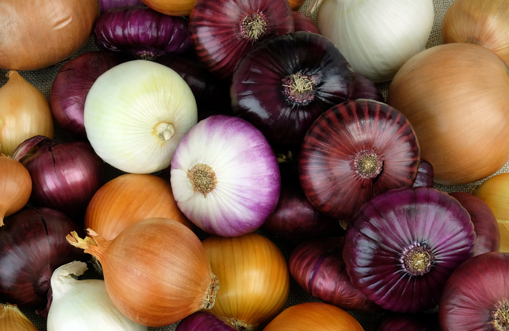 A mix of white, yellow, and red onions. 