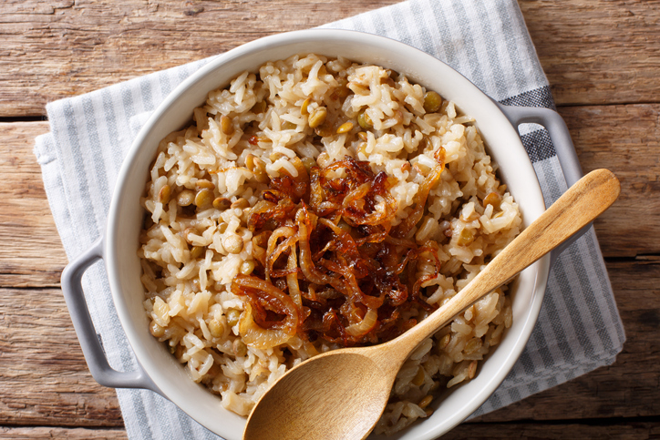 Caramelized onions topping a dish of rice and lentils. 