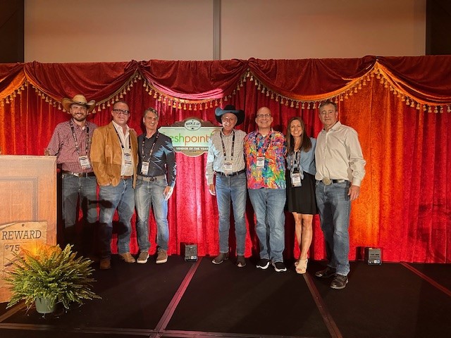 Texas Roadhouse and FreshPoint colleagues on the conference stage for the Texas Roadhouse's Vendor of the Year Award.